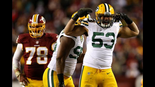 LANDOVER, MD - JANUARY 10: Outside linebacker Nick Perry #53 and defensive end Datone Jones #95 of the Green Bay Packers react to a play against the Washington Redskins during the NFC Wild Card Playoff game at FedExField on January 10, 2016 in Landover, Maryland. (Photo by Patrick Smith/Getty Images)