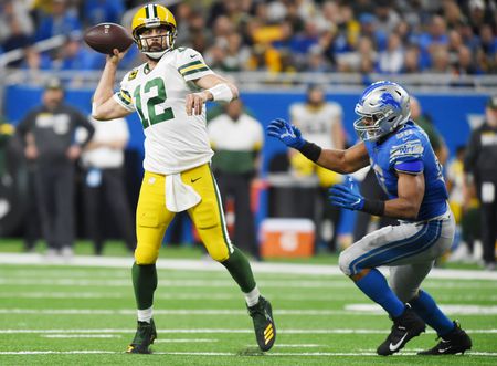 Packers clinch NFC North with victory over the Lions.