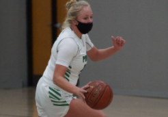 Junior Addie Stott dribbles the ball down the court.