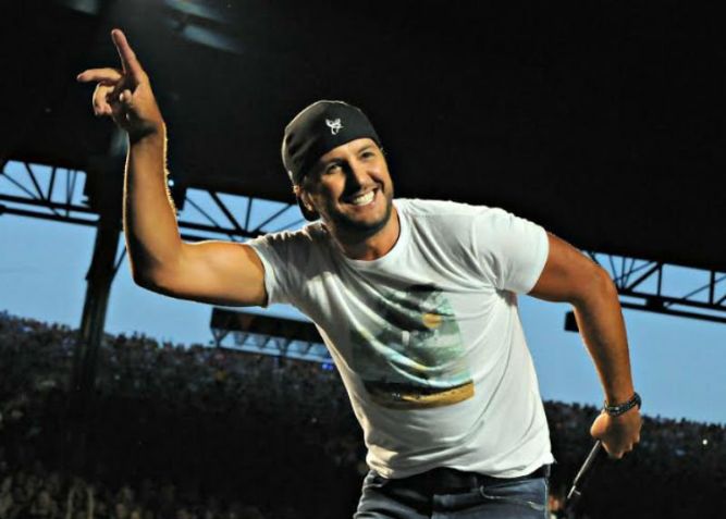 Country singer Luke Bryan performs in front of a packed crowd.