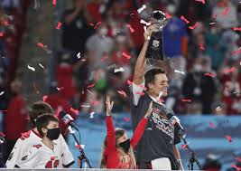 Tom Brady hoists Super Bowl up trophy after leading the Buccaneers to victory.