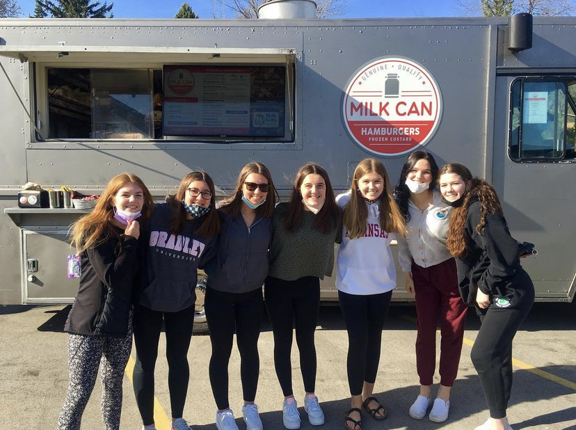 A group of girls enjoy trying different foods at the Food Truck Frenzy.