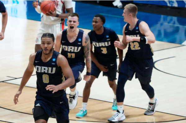 Oral Roberts players celebrate after defeating the number two seed, Ohio State.
