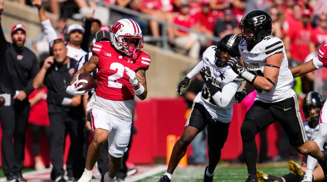 Badgers are taking care of Business but Struggle against Ranked Schools