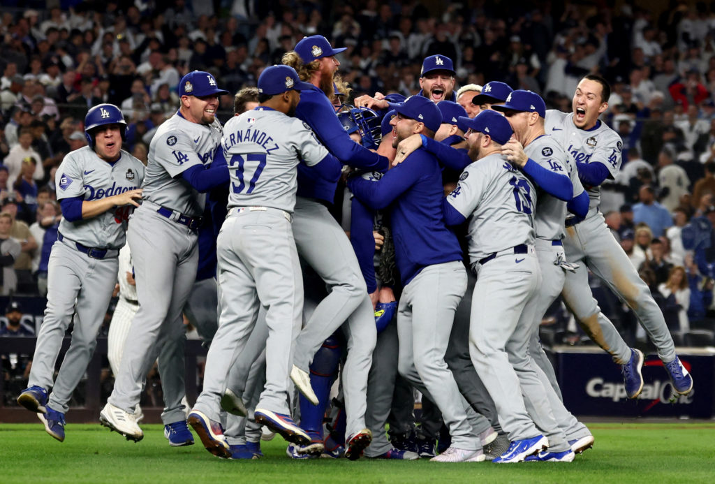 Oct 30, 2024; New York, New York, USA; Los Angeles Dodgers players and coaches celebrate after winning the 2024 MLB World Series against the New York Yankees at Yankee Stadium. Mandatory Credit: Vincent Carchietta-Imagn Images     TPX IMAGES OF THE DAY