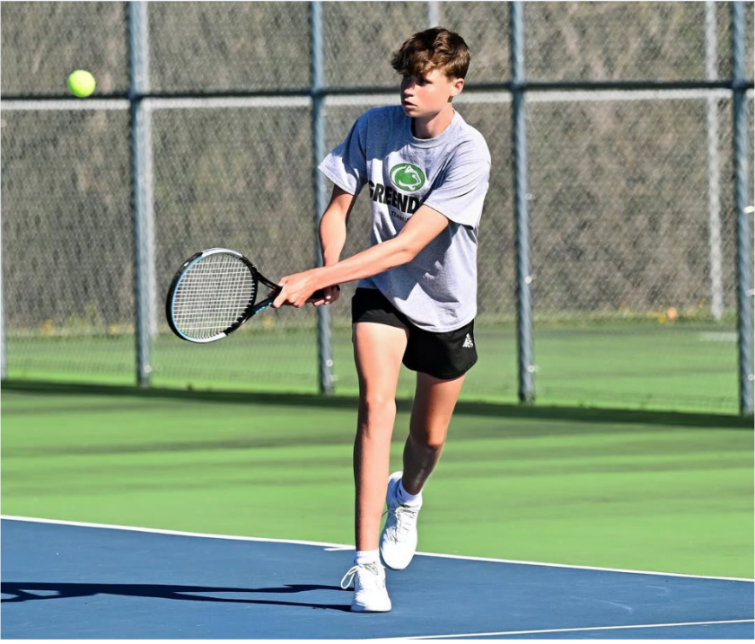 Boys Tennis Team Hustles on the Court